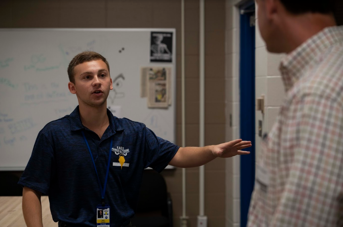 Sales Manager Tanner Bowman explains the Eagle Manufacturing process to Stan Pinegar