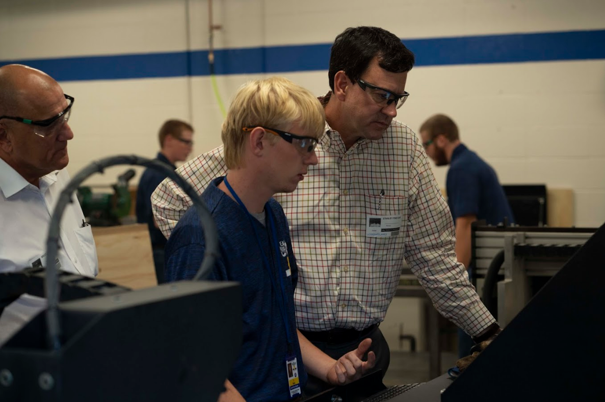 CNC Operator Ty Wesley demonstrates CNC processes